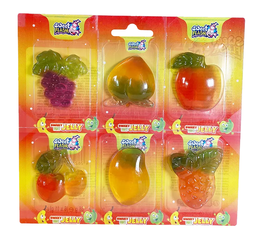 Eine Verpackung mit bunten, fruchtförmigen Geleestücken in verschiedenen Farben: Traube, Pfirsich, Apfel, Orange und Erdbeere.